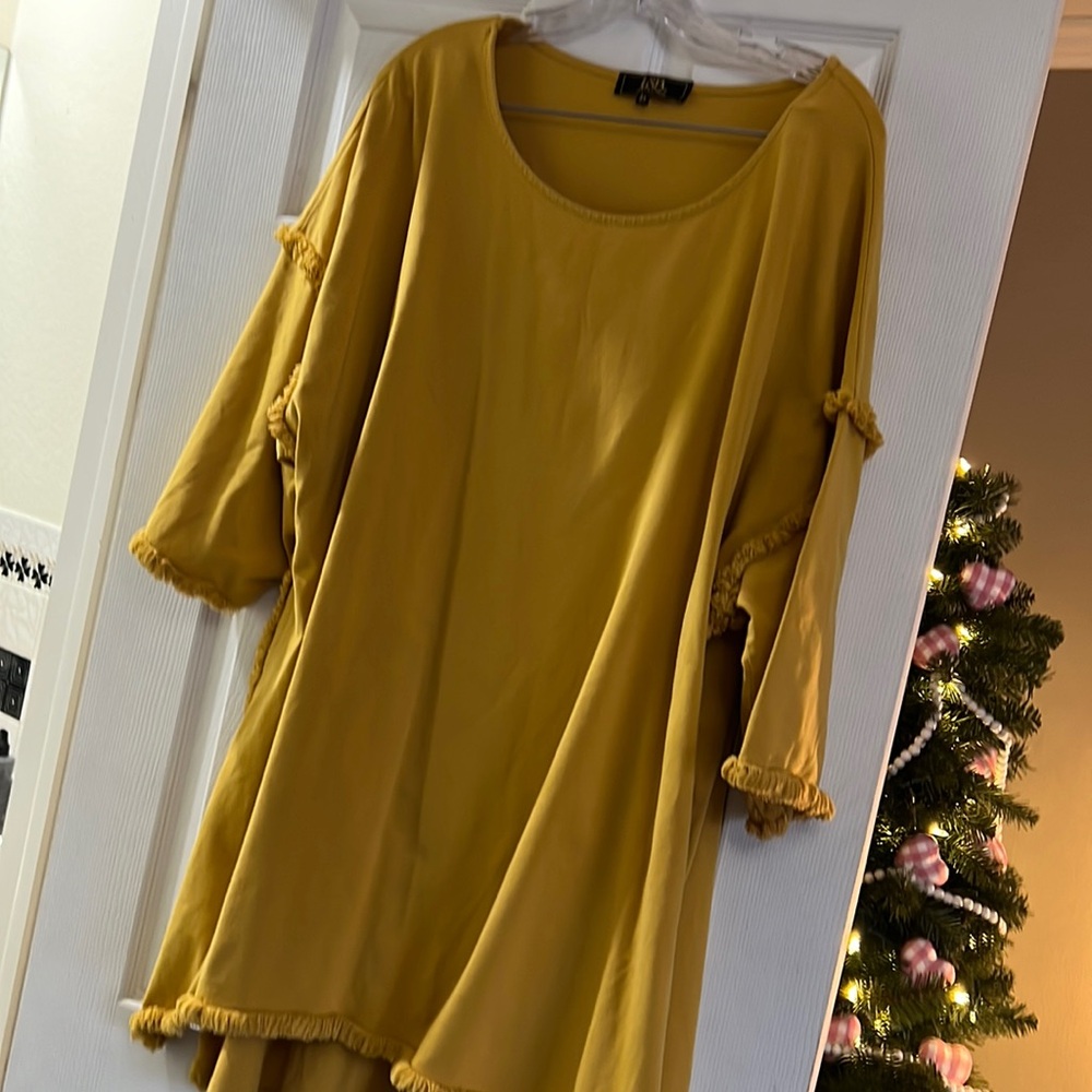 short sleeved gold tunic . worn , but lots of wear left .